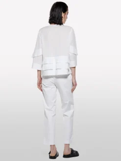 Blusa bianca con balze