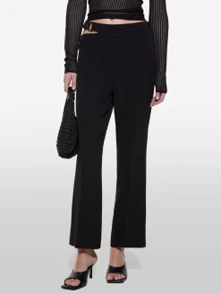 Pantaloni neri con catena