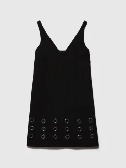 Vestito corto con occhielli